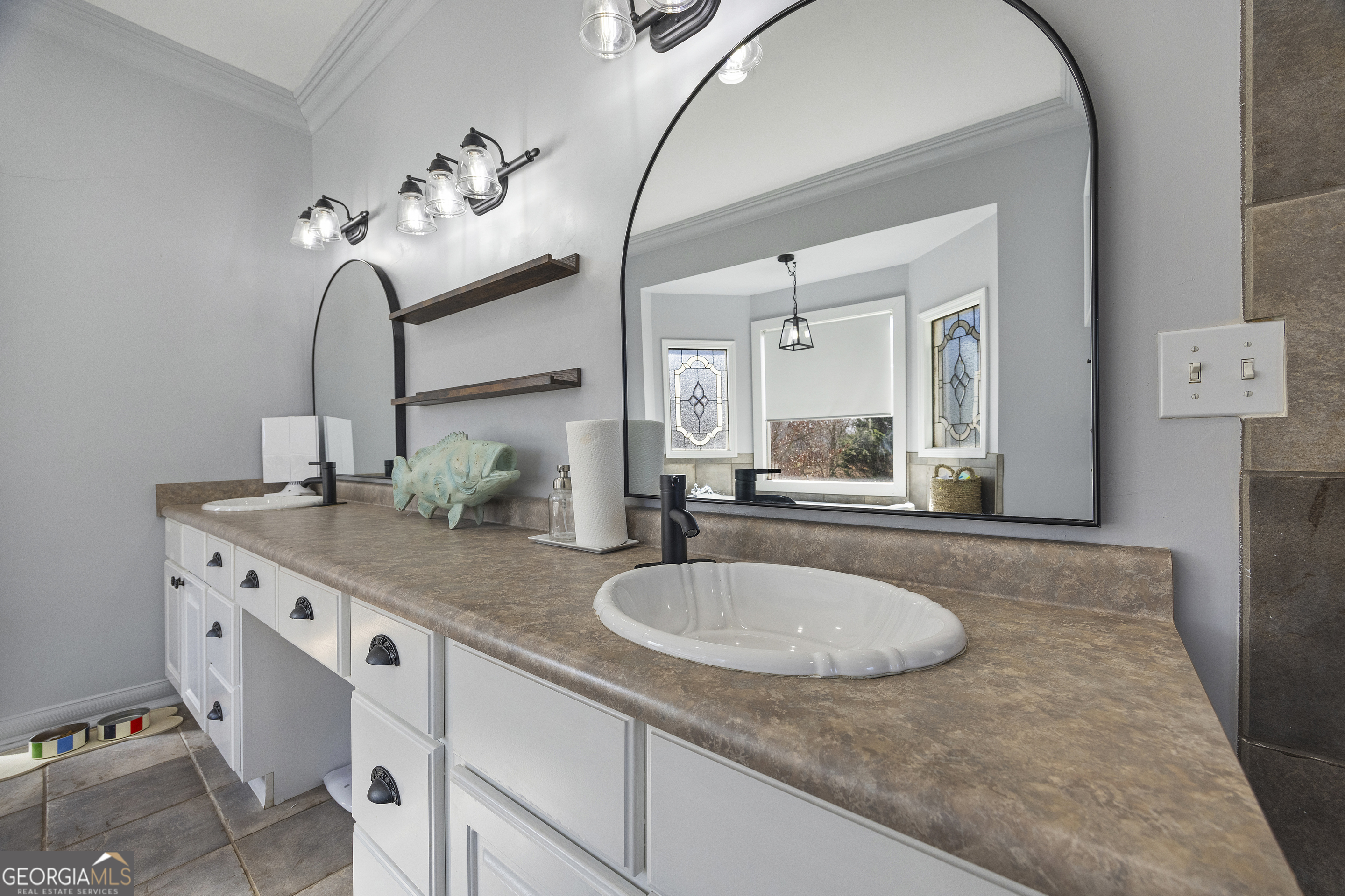 2565 New Franklin Church Road Canon, GA 30520 - Photo 25 of 168 a bathroom with a granite countertop sink a mirror and shower