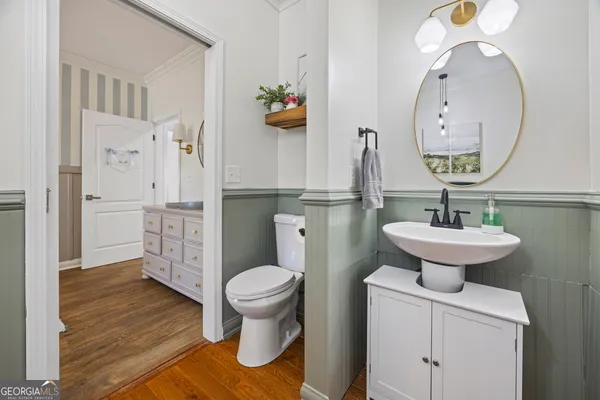a spacious bathroom with a double vanity sink a mirror and a shower