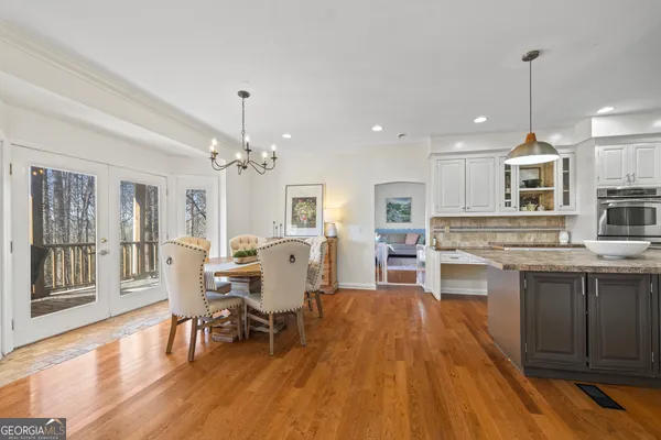 a view of a balcony with wooden floor and a ceiling fan
