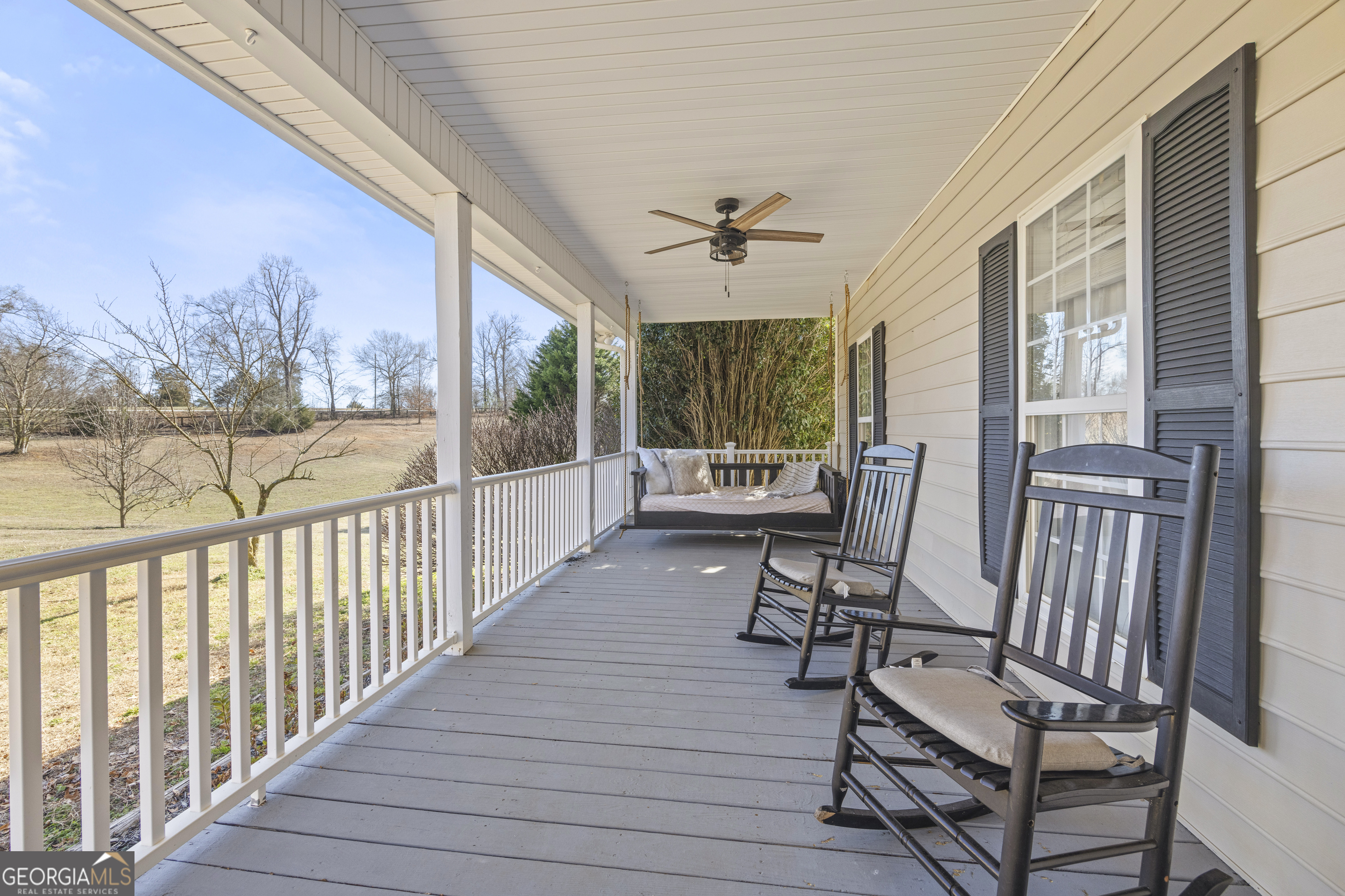 2565 New Franklin Church Road Canon, GA 30520 - Photo 4 of 168 a view of a porch with furniture and wooden floor