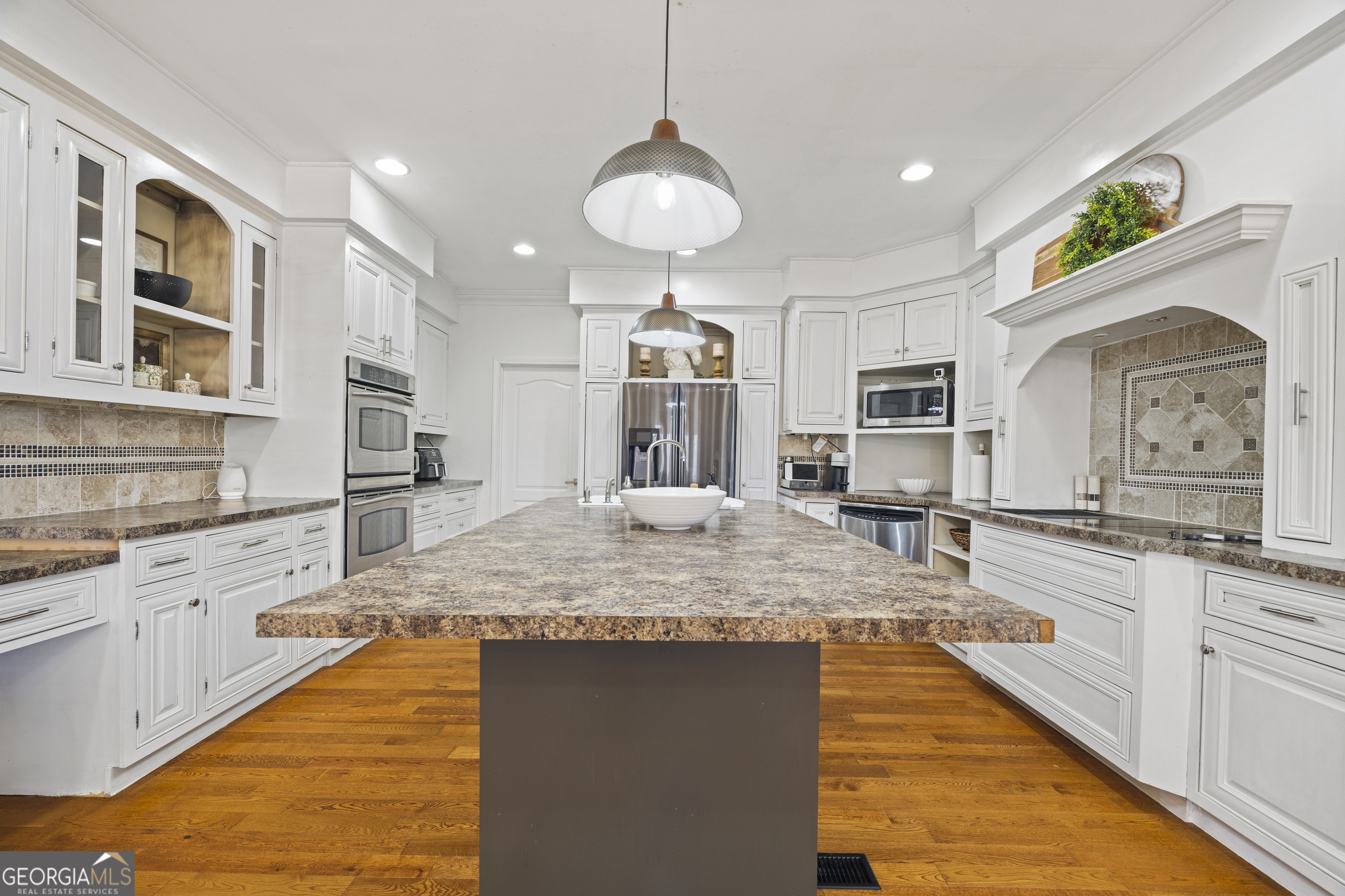 2565 New Franklin Church Road Canon, GA 30520 - Photo 46 of 168 a kitchen with stainless steel appliances granite countertop a stove and cabinets
