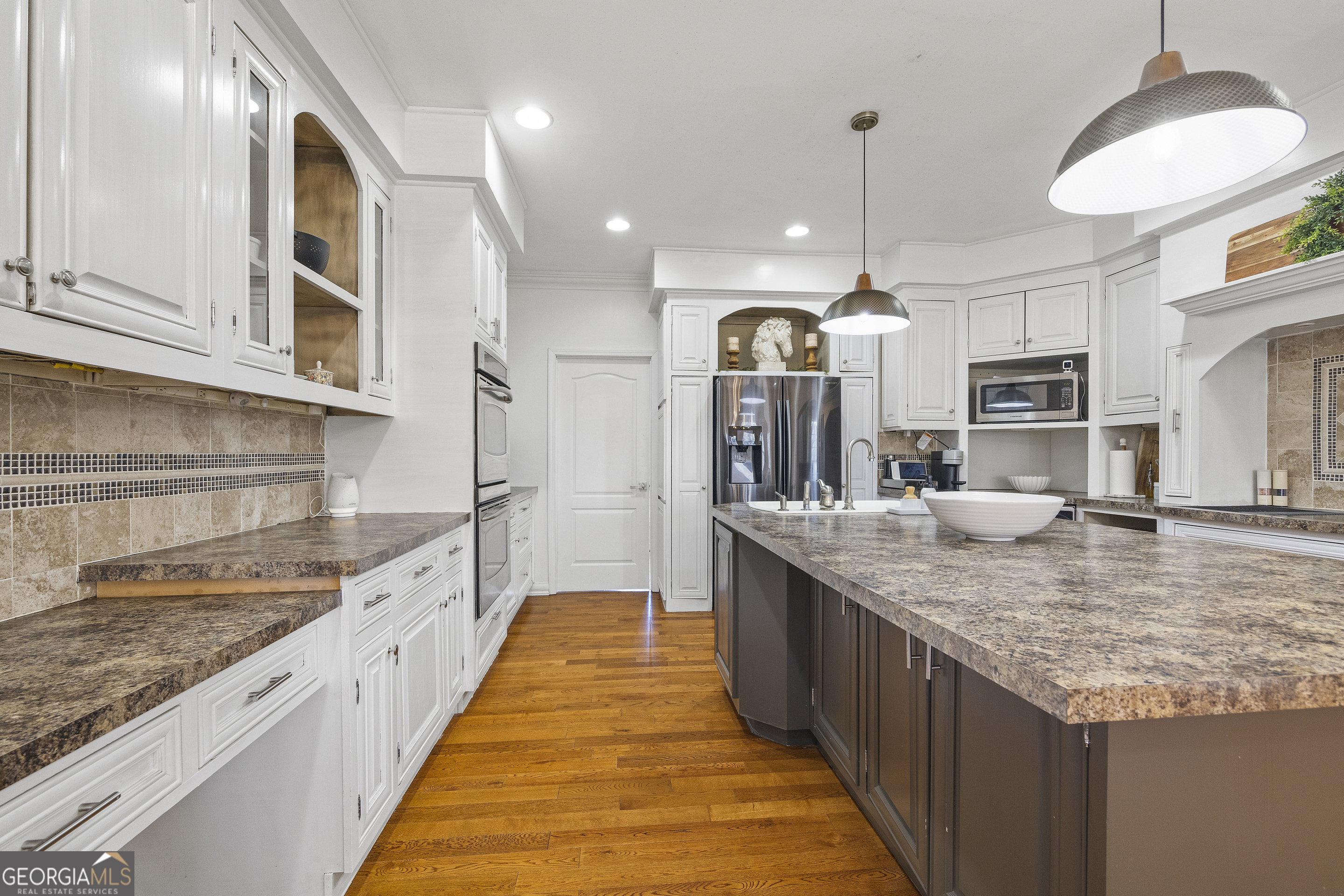 2565 New Franklin Church Road Canon, GA 30520 - Photo 59 of 168 a large kitchen with granite countertop a sink and dishwasher a stove top oven with wooden floor
