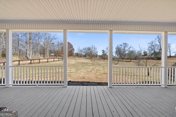 a white bath tub sitting next to a bathroom
