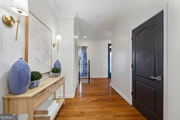 a bathroom with a granite countertop sink a mirror and shower