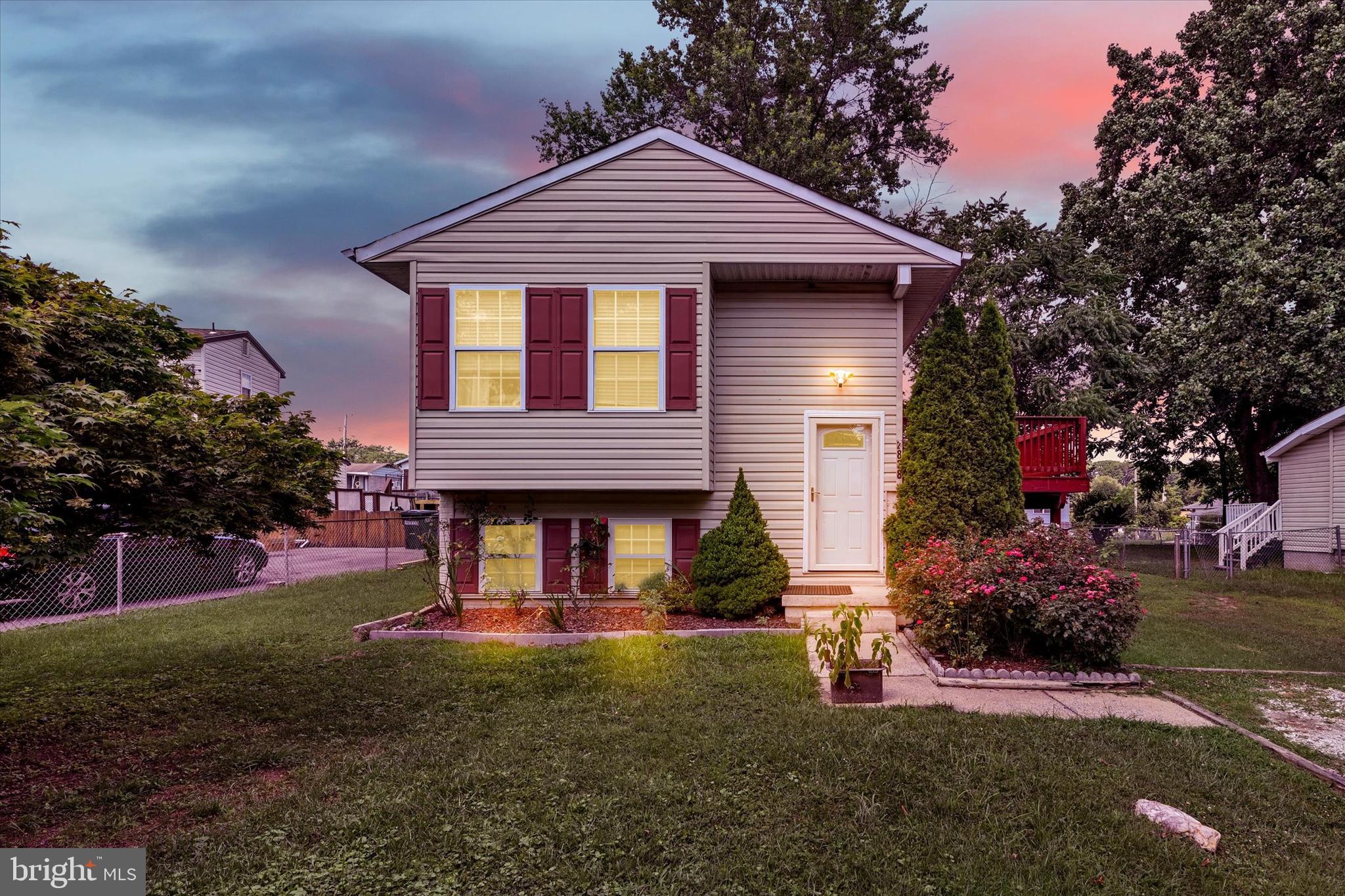 front view of a house with a yard