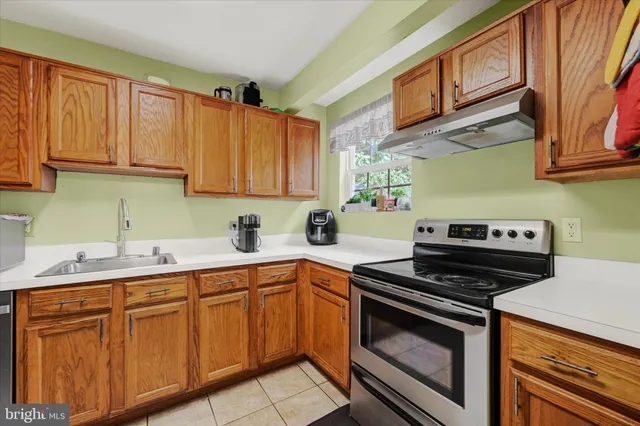 a kitchen with cabinets and appliances