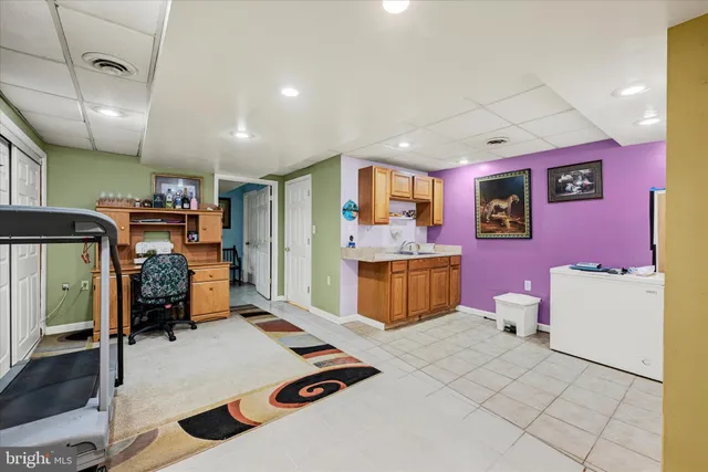 a bedroom with furniture and a flat screen tv