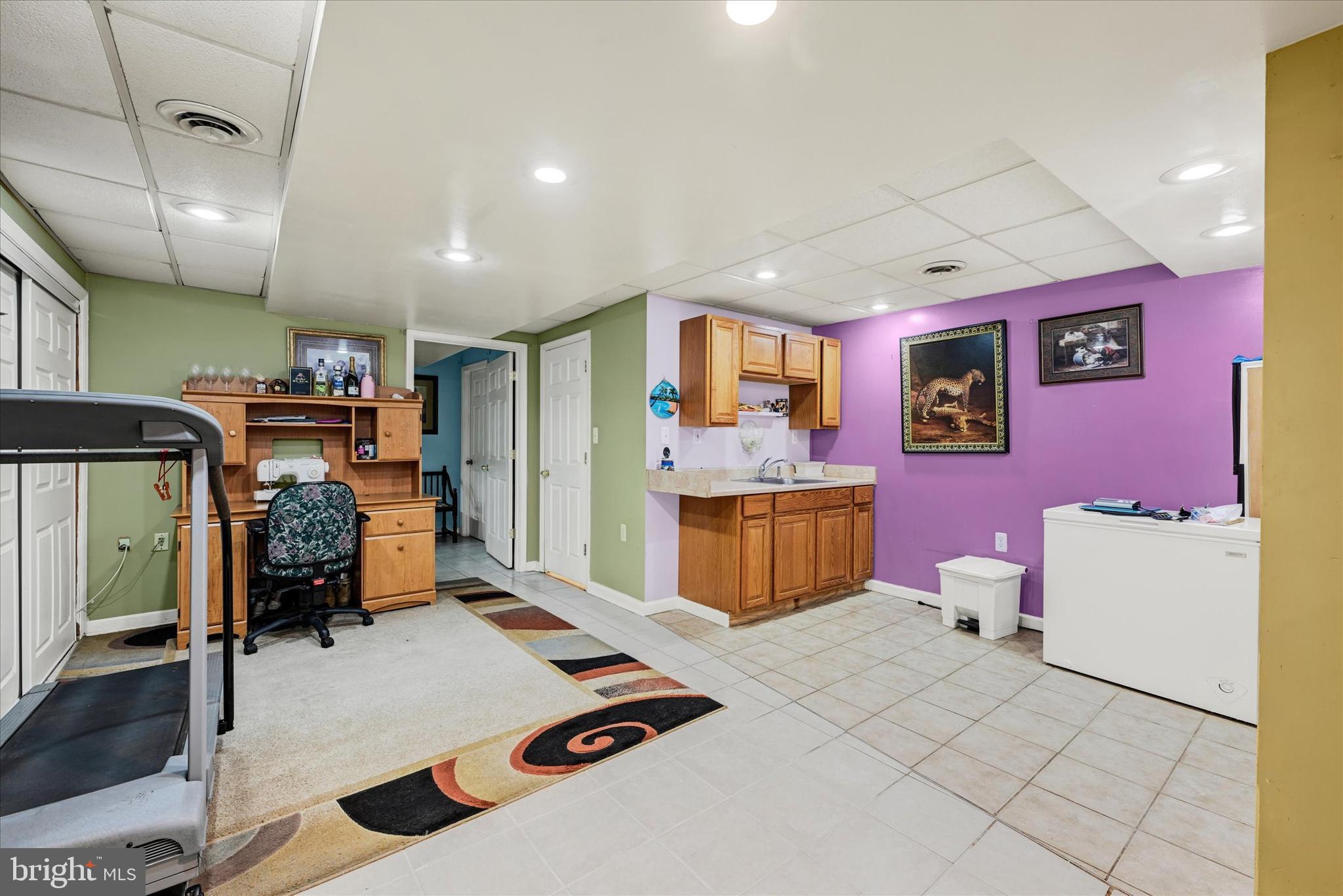 2838 Pennsylvania Avenue Baltimore, MD 21227 - Photo 17 of 32 a bedroom with furniture and a flat screen tv