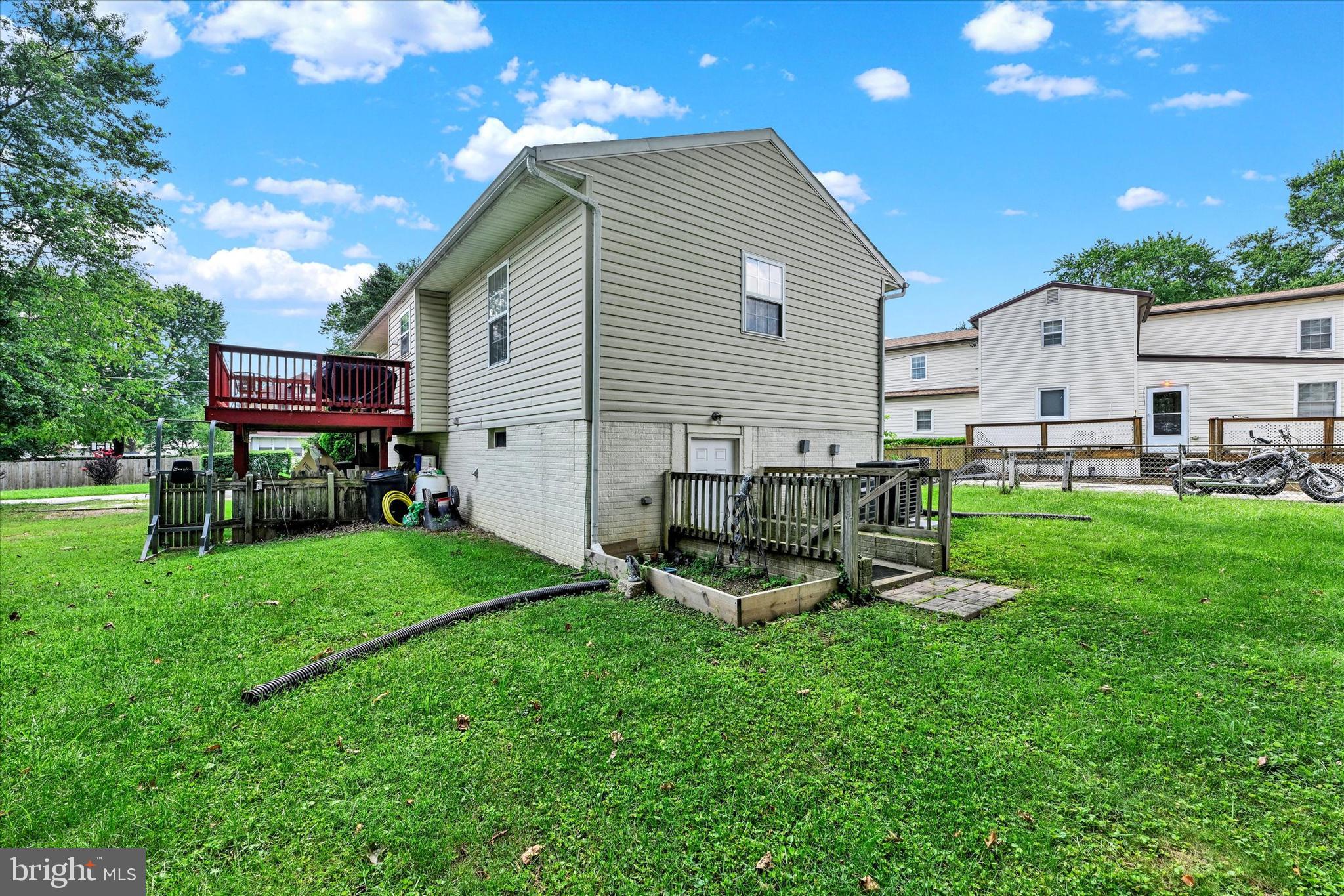2838 Pennsylvania Avenue Baltimore, MD 21227 - Photo 24 of 32 a view of a house with backyard sitting area and garden
