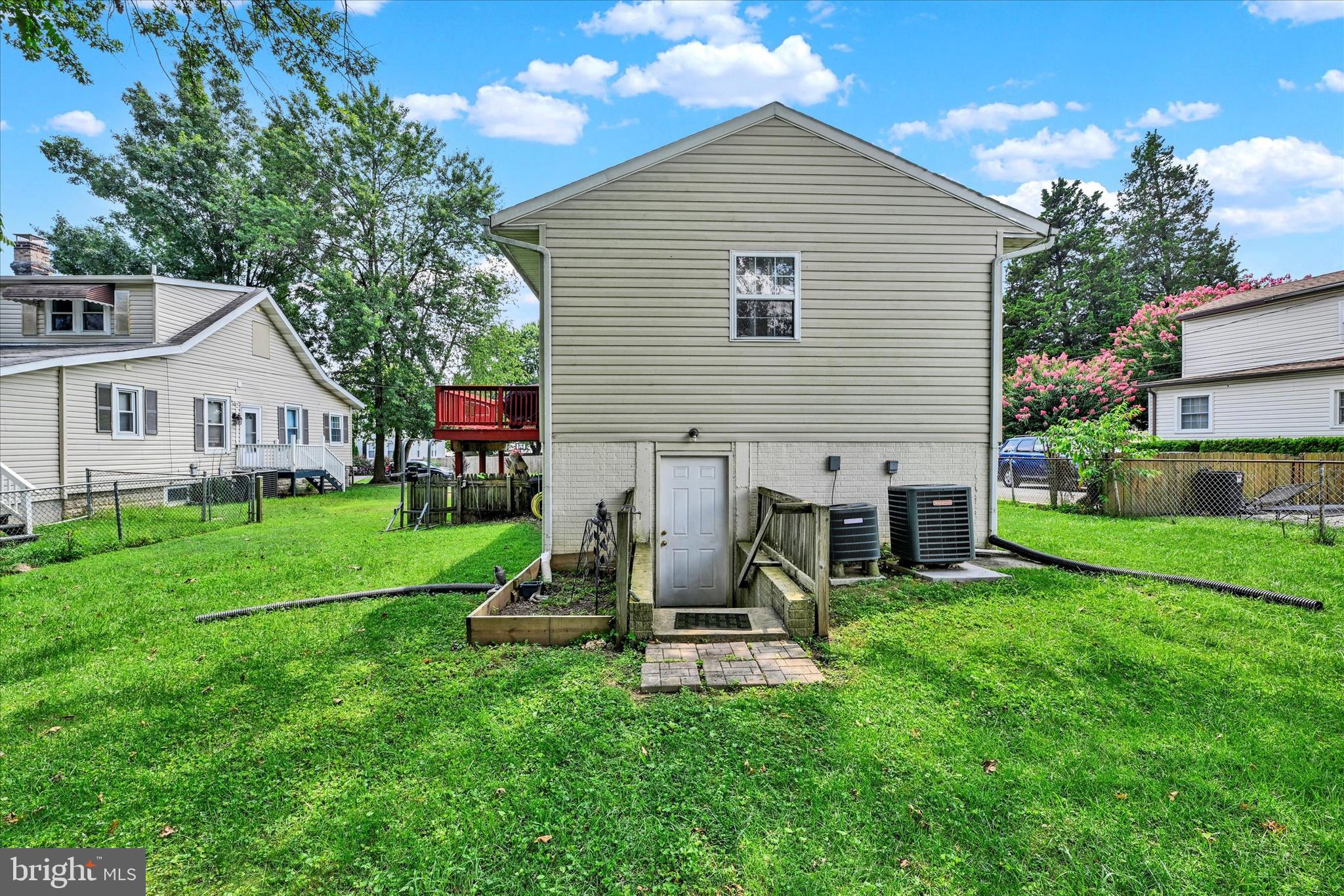 2838 Pennsylvania Avenue Baltimore, MD 21227 - Photo 25 of 32 a view of a house with a yard and sitting area