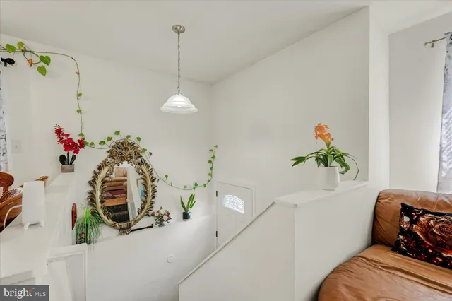 a bedroom with furniture and a chandelier
