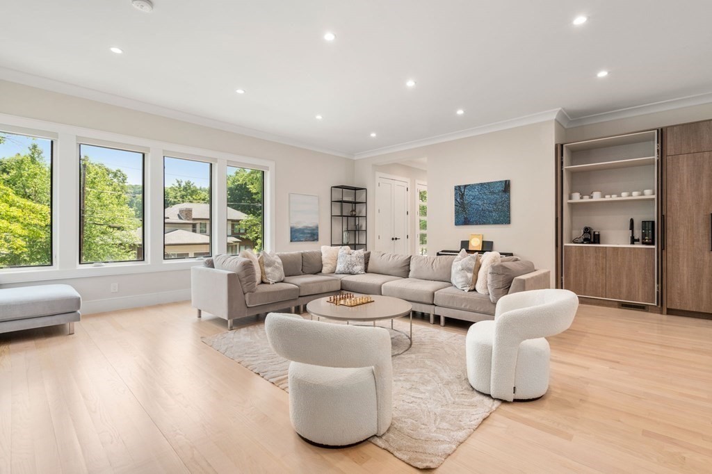 17 Valley Spring Road Newton, MA 02458 - Photo 3 of 4 a living room with furniture and large windows