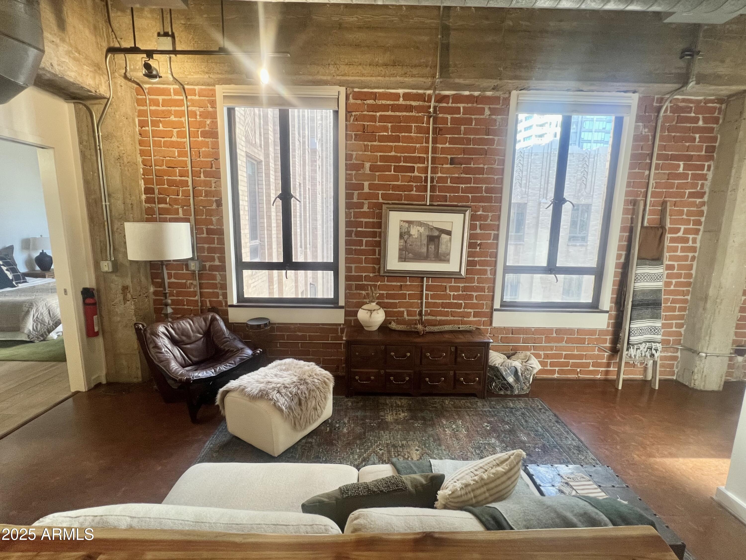 114 West Adams Street, Unit 1007 Phoenix, AZ 85003 - Photo 14 of 63 a living room with furniture and a window