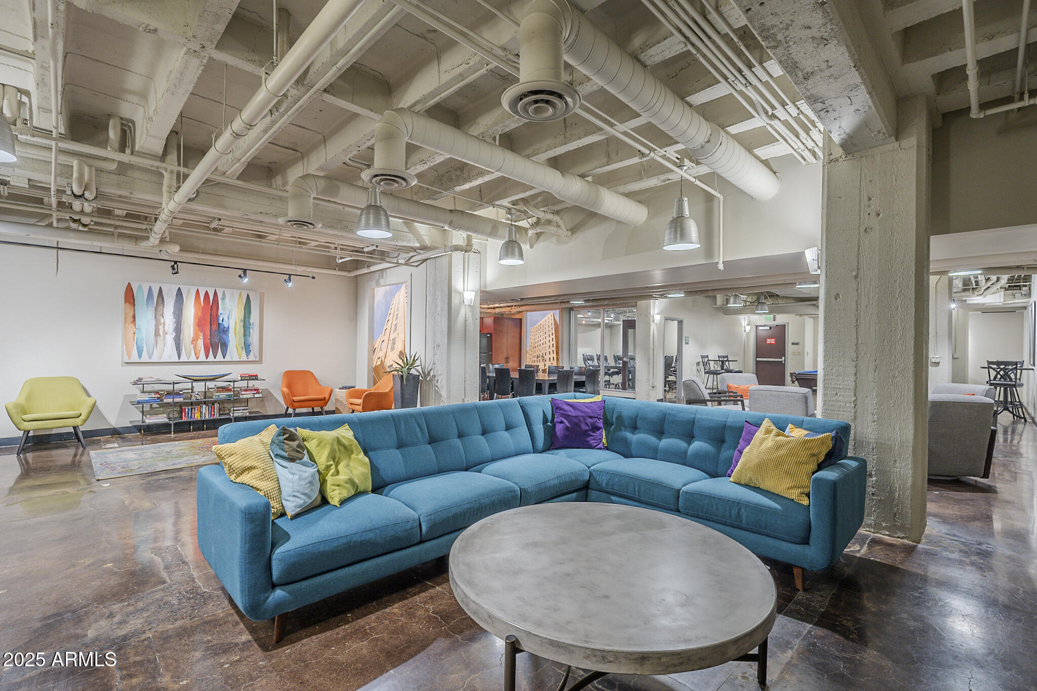 114 West Adams Street, Unit 1007 Phoenix, AZ 85003 - Photo 45 of 63 a living room with furniture and a chandelier