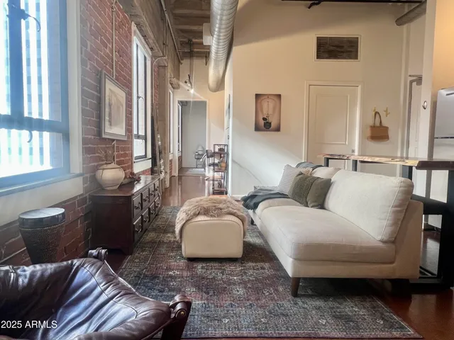 a living room with furniture and a window