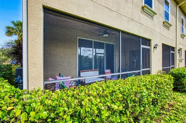 a view of a house with yard and sitting area