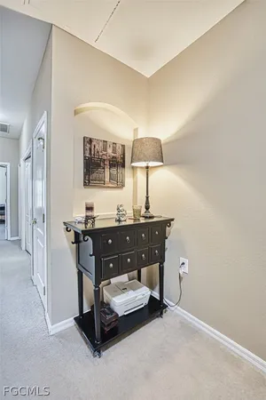 a room with a sink and a mirror