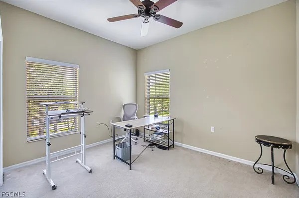a workspace with furniture and a window