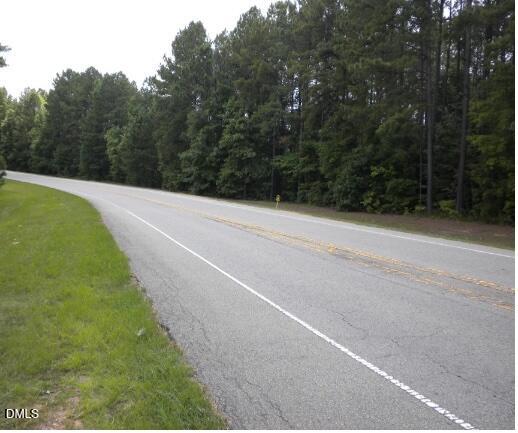 0 Colon Road Sanford, NC 27330 - Photo 9 of 10 a view of a field with trees in the background