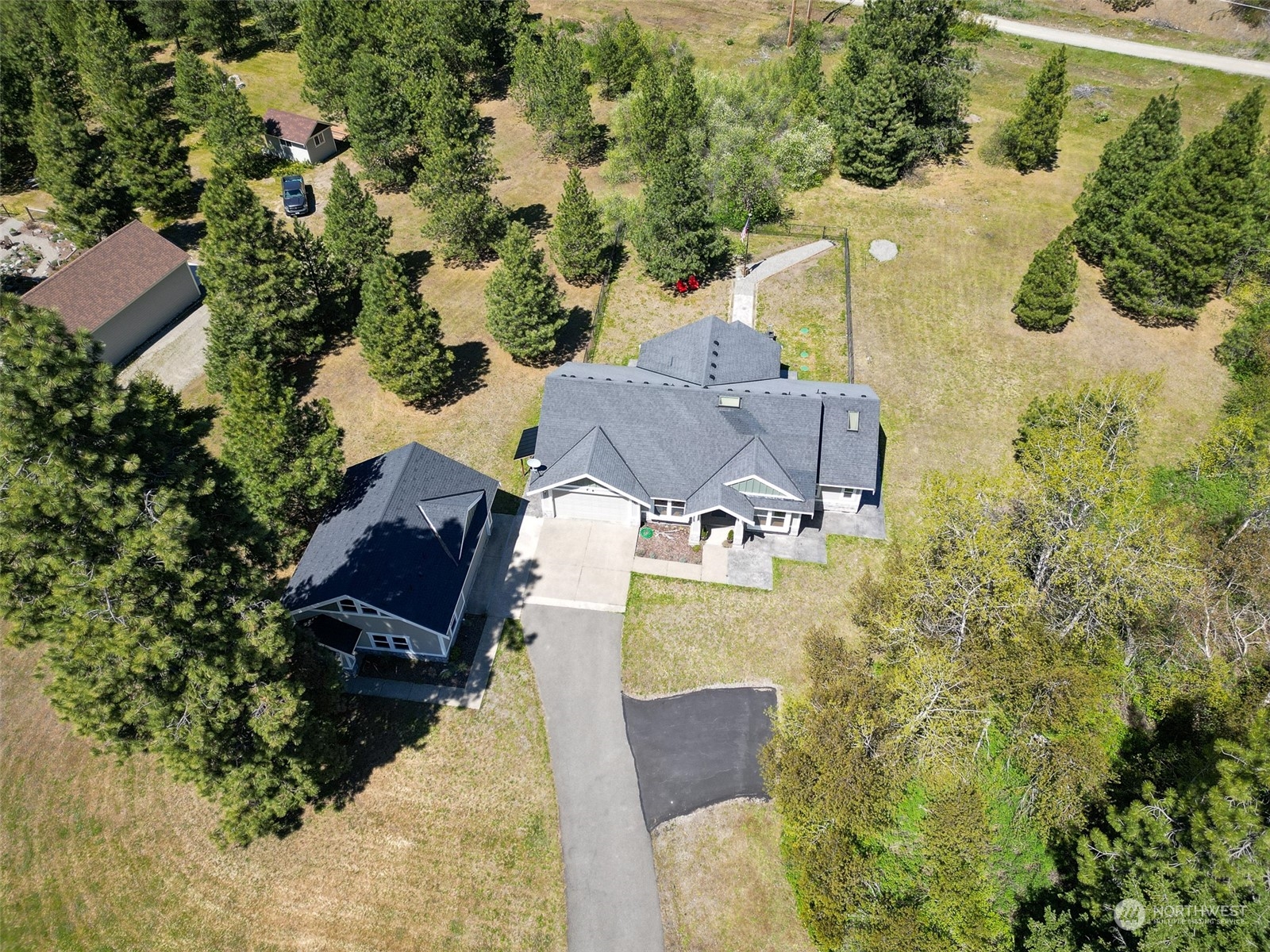 551 Old Cedars Road Cle Elum, WA 98922 - Photo 4 of 39 an aerial view of a house with swimming pool and outdoor seating