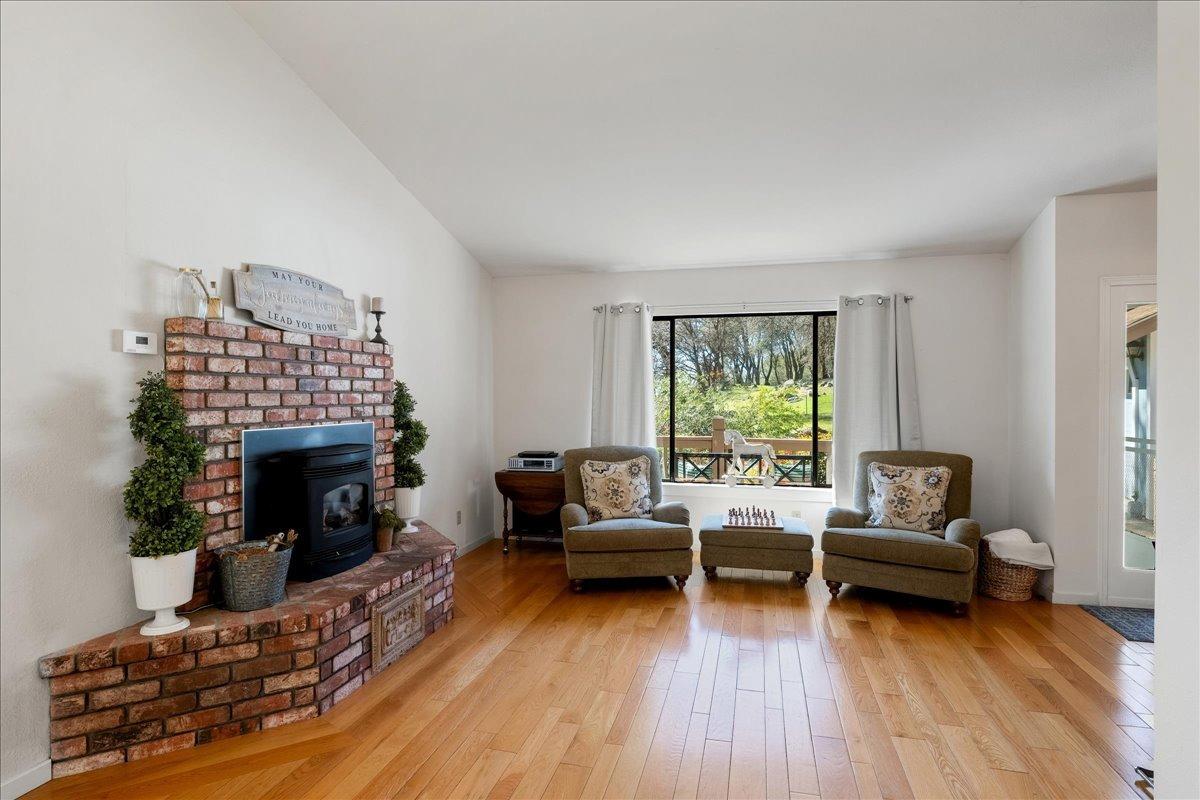 13936 Oak Ridge Road Penn Valley, CA 95946 - Photo 18 of 83 a living room with furniture and a fireplace