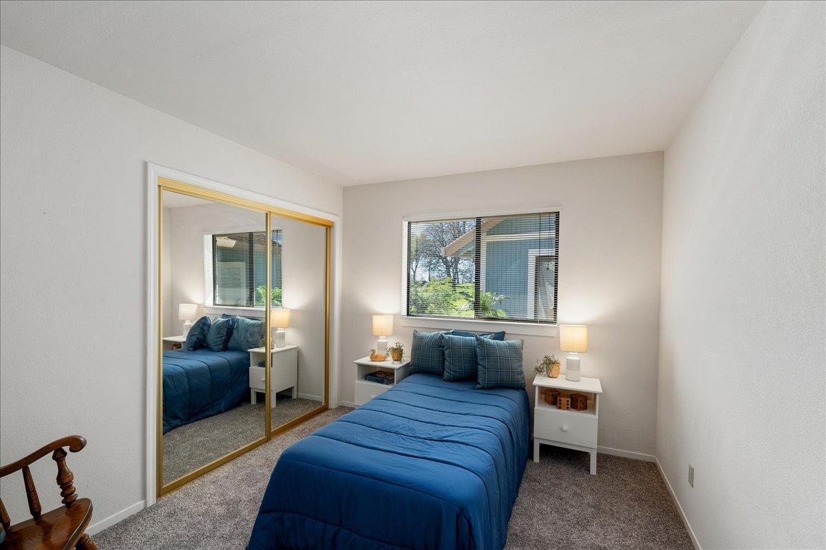 13936 Oak Ridge Road Penn Valley, CA 95946 - Photo 32 of 83 a bedroom with furniture and a large window