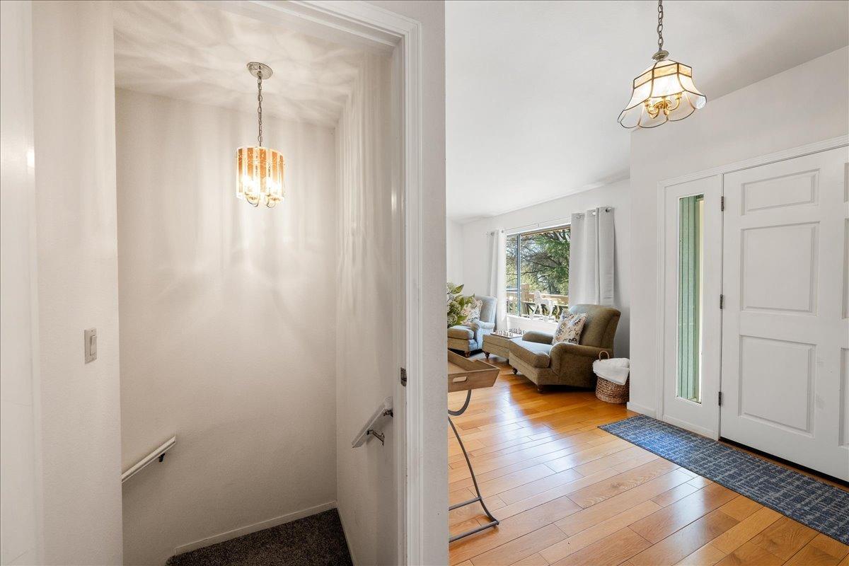 13936 Oak Ridge Road Penn Valley, CA 95946 - Photo 35 of 83 a living room with furniture and a chandelier