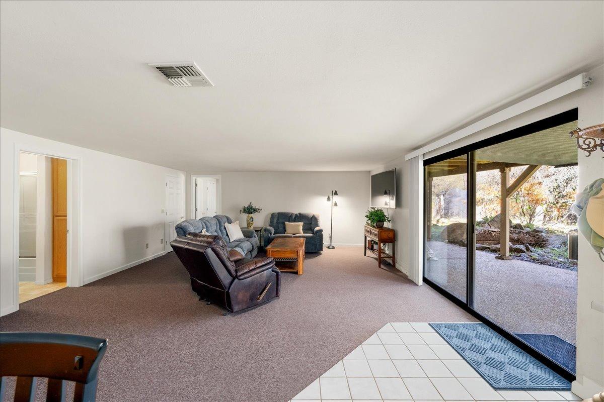 13936 Oak Ridge Road Penn Valley, CA 95946 - Photo 36 of 83 a living room with furniture and large windows