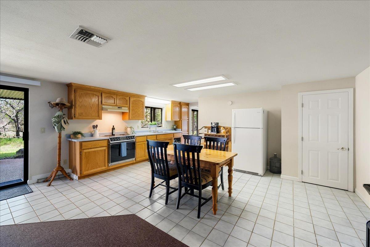 13936 Oak Ridge Road Penn Valley, CA 95946 - Photo 40 of 83 a view of a dining room kitchen and a window