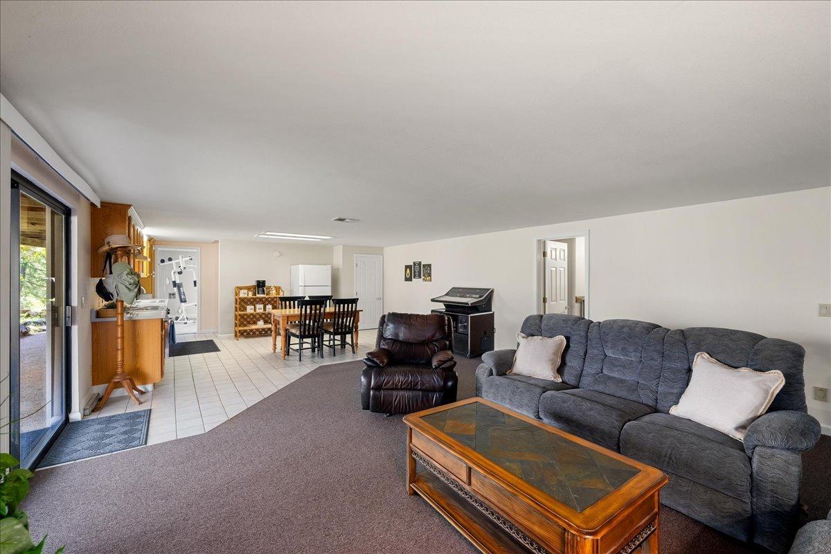 13936 Oak Ridge Road Penn Valley, CA 95946 - Photo 41 of 83 a living room with furniture a couch and bookshelf