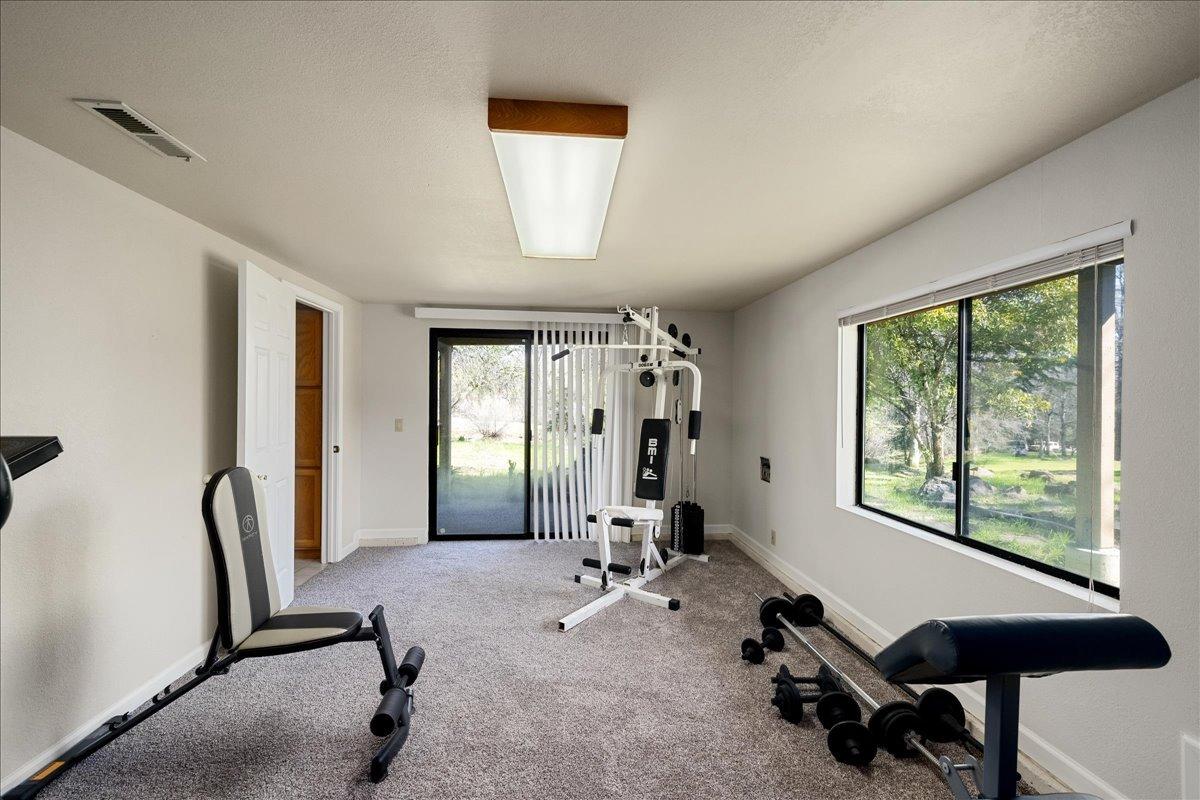 13936 Oak Ridge Road Penn Valley, CA 95946 - Photo 45 of 83 a view of a livingroom with workspace and a window