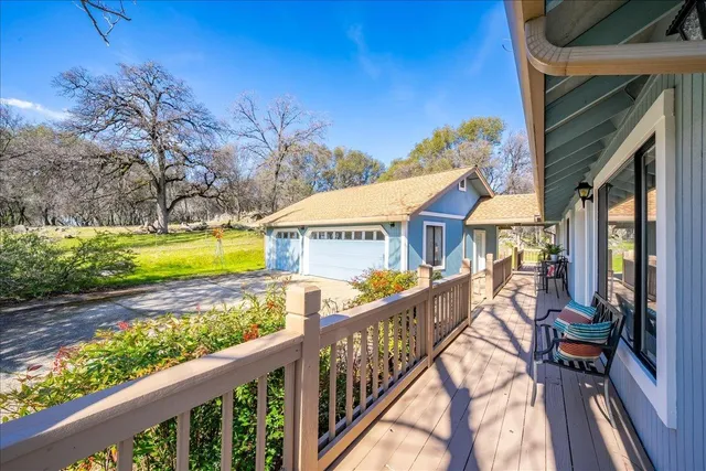 a view of a yard with swimming pool and sitting area