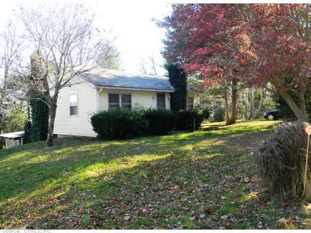 168 Calvin French Road Sterling, CT 06377 - Photo 1 of 1 a front view of house with yard and green space