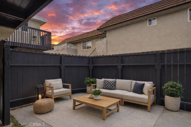 a outdoor living space with furniture and a potted plant