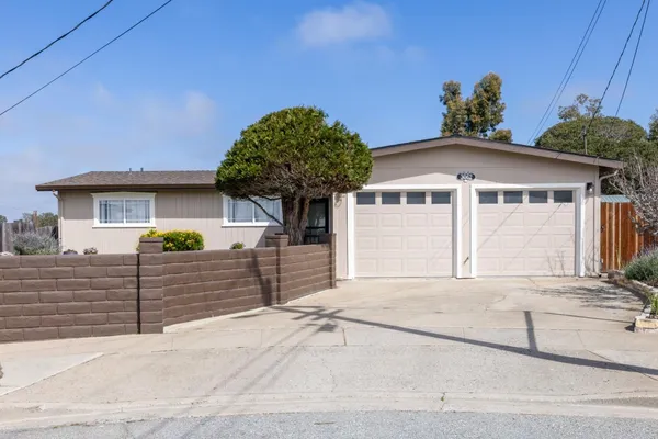 a front view of a house with a garage