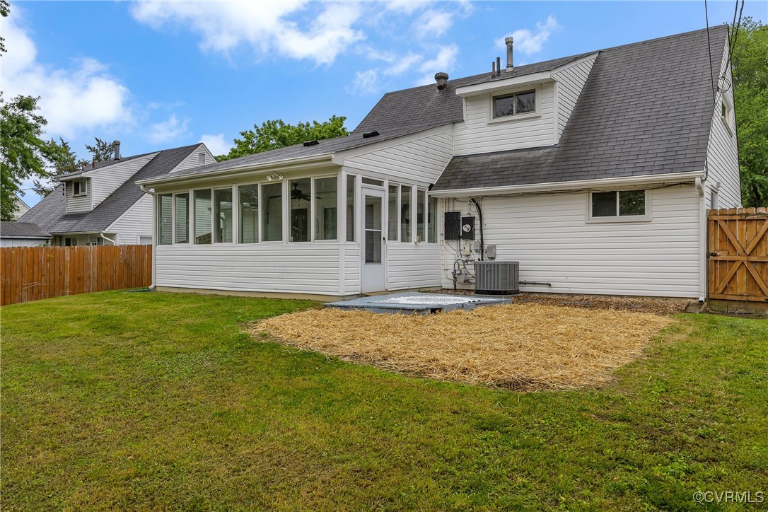 5612 Indigo Road Richmond, VA 23230 - Photo 26 of 27 Back of property with a sunroom, cooling unit, and