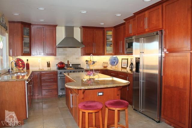 885 Erringer Road Simi Valley, CA 93065 - Photo 14 of 31 a kitchen with stainless steel appliances granite countertop a sink stove and refrigerator