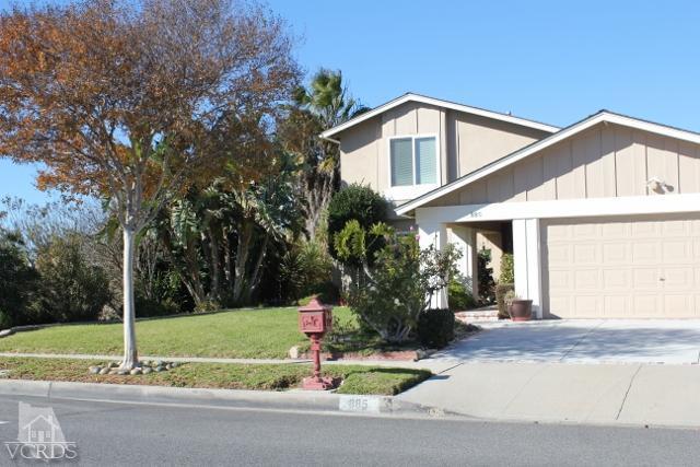 885 Erringer Road Simi Valley, CA 93065 - Photo 3 of 31 a front view of a house with a yard and trees