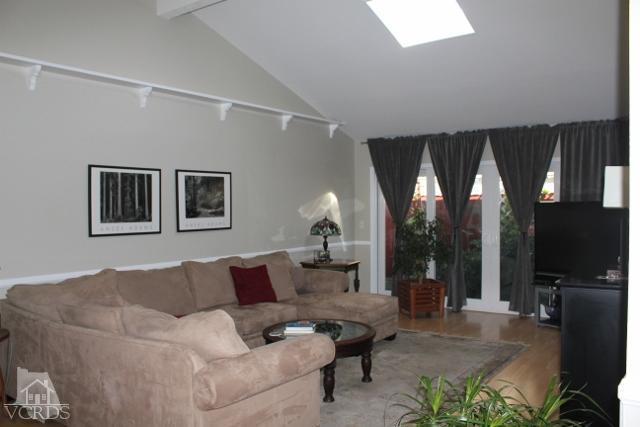885 Erringer Road Simi Valley, CA 93065 - Photo 7 of 31 a living room with furniture and a flat screen tv