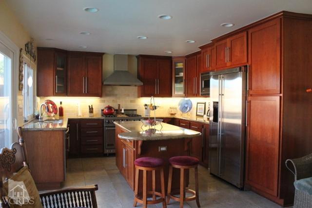 885 Erringer Road Simi Valley, CA 93065 - Photo 9 of 31 a kitchen with stainless steel appliances granite countertop a refrigerator stove microwave and sink