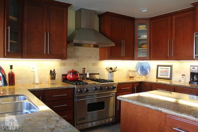 885 Erringer Road Simi Valley, CA 93065 - Photo 10 of 31 a kitchen with a stove and a sink