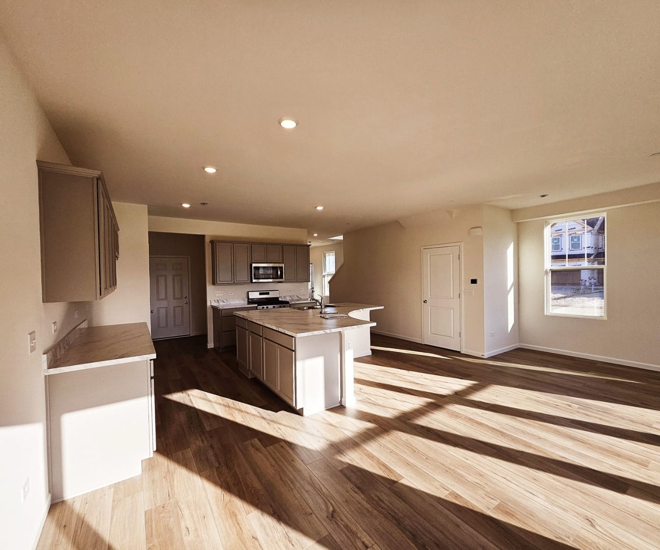 2212 Horseshoe Circle, Unit 2212 Plainfield, IL 60585 - Photo 12 of 12 a kitchen with a sink and a stove top oven
