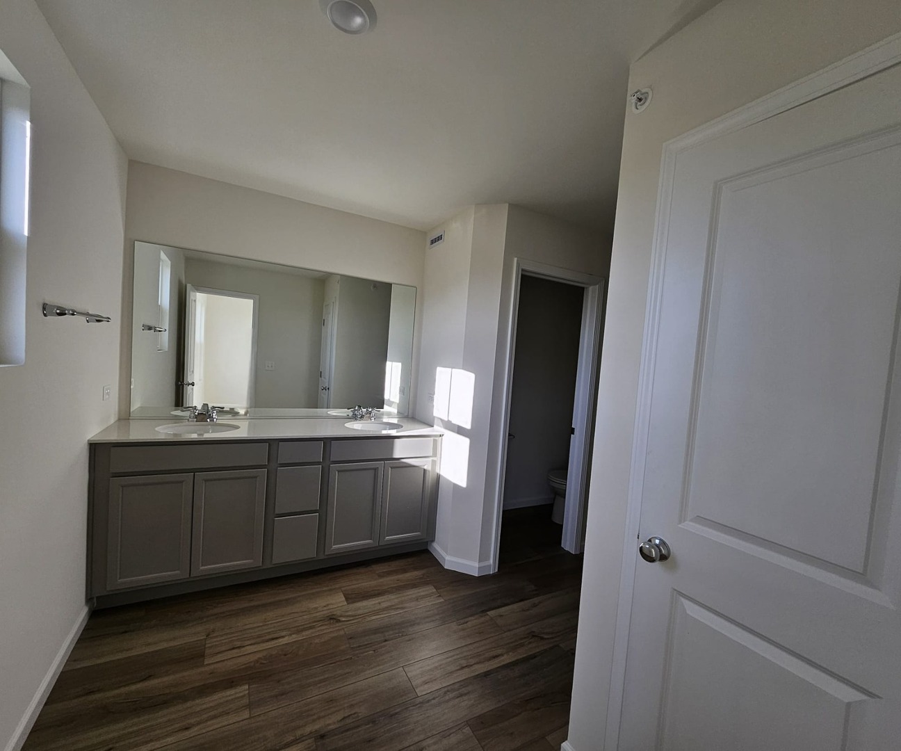 2212 Horseshoe Circle, Unit 2212 Plainfield, IL 60585 - Photo 5 of 12 a bathroom with a sink and a mirror