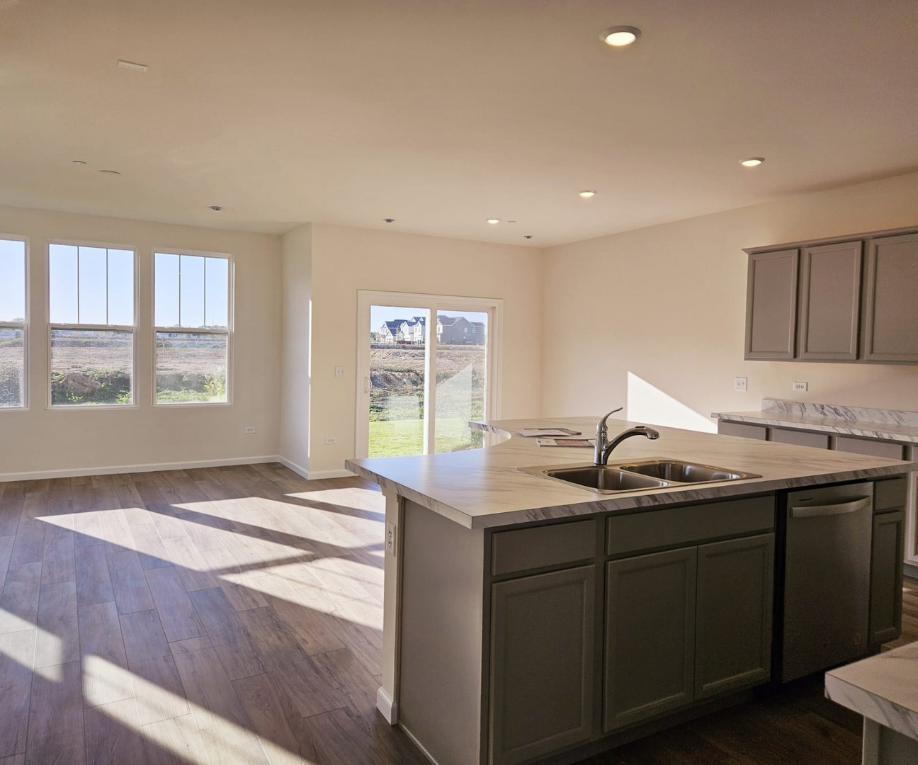 2212 Horseshoe Circle, Unit 2212 Plainfield, IL 60585 - Photo 7 of 12 a kitchen with a sink and large window