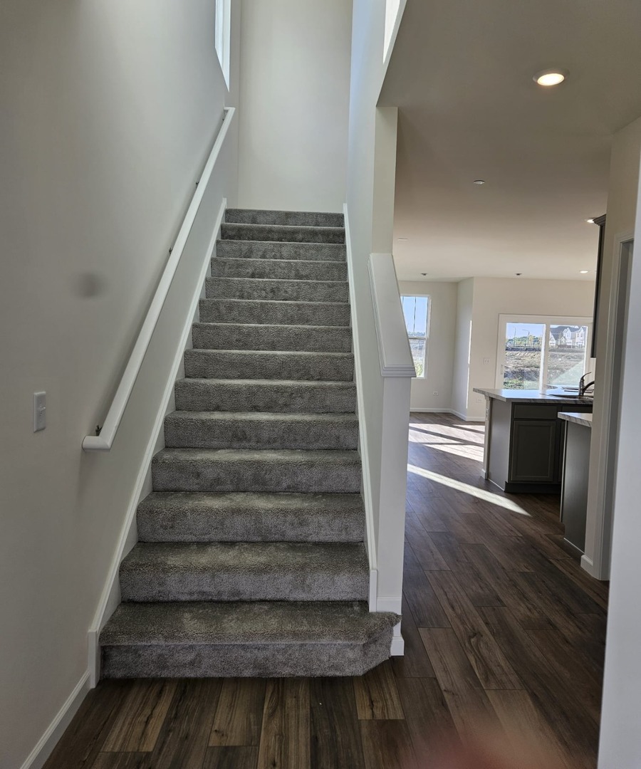 2212 Horseshoe Circle, Unit 2212 Plainfield, IL 60585 - Photo 9 of 12 a view of entryway and hall with wooden floor