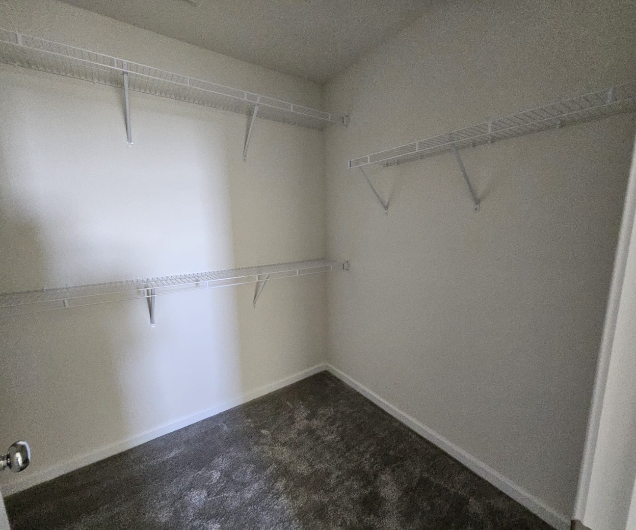 2212 Horseshoe Circle, Unit 2212 Plainfield, IL 60585 - Photo 10 of 12 a view of a room with racks on the wall