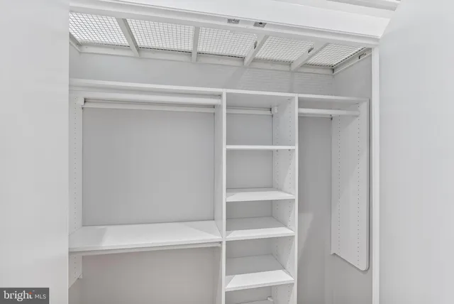 a view of an empty walk in closet