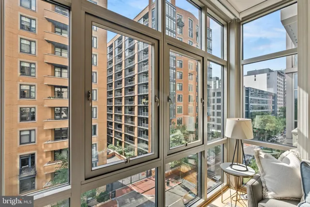 a view of an chairs and table in the balcony