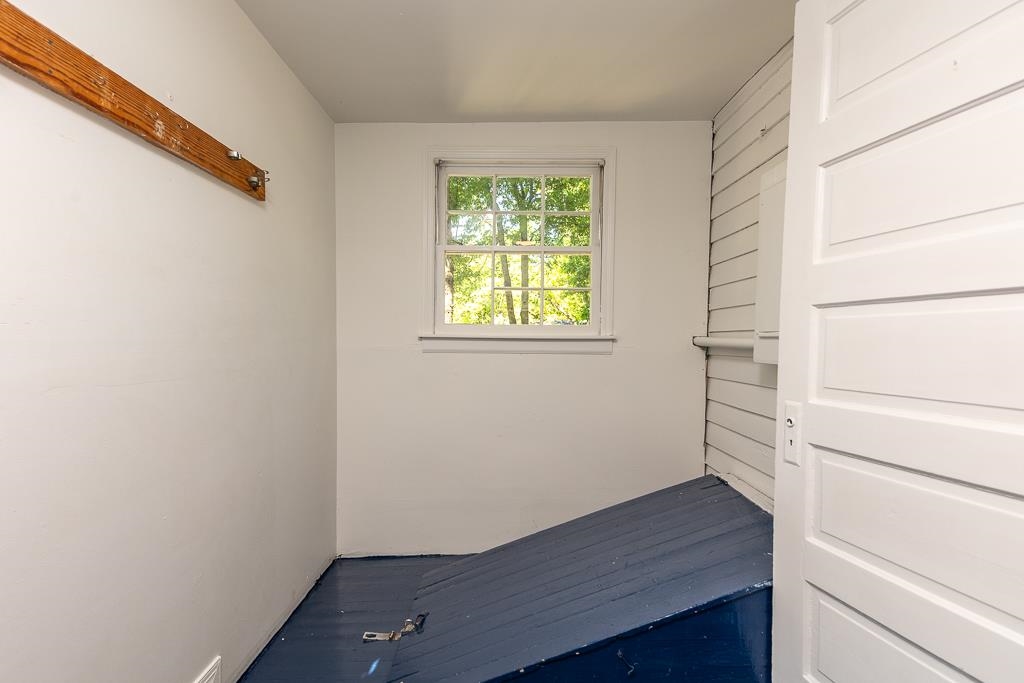 119 South Fenwick Road Memphis, TN 38111 - Photo 20 of 28 a view of an empty room with wooden floor and a window