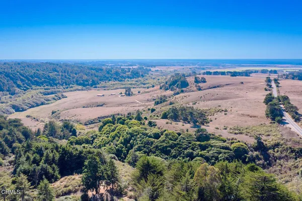 an aerial view of beach and city
